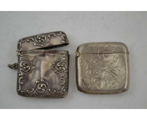 WILLIAM LEWIS AN EDWARDIAN SILVER VESTA CASE, repousse decorated, Birmingham 1903, together with one other SILVER VESTA CASE 