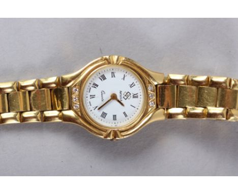 A lady's Artejoia yellow metal bracelet watch with white enamel dial, diamond mounted bezel and quartz movement, 48.8g gross 