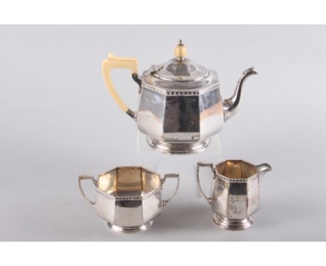 An octagonal silver three-piece teaset, the teapot with ivory handle and knop, 36.6oz troy approx overall 