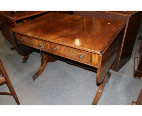 A mahogany drop flap sofa table, fitted two drawers, on splayed and castored supports, 35" wide x 24" deep x 27" highConditio