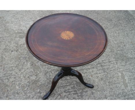 A Georgian mahogany circular fan paterae inlaid tilt top table, on birdcage and turned column tripod splay support, 24" dia x