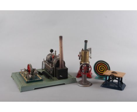 A Fleischmann tin-plate live steam engine and workshop, including circular saw, press and spiral, on rectangular base 