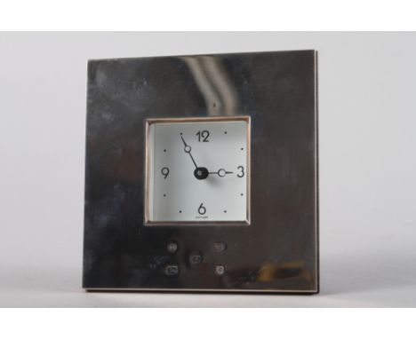 A silver cased square shaped quartz mantel clock with white metal enamel dial and Arabic and dotted numerals, 4 3/4" square 