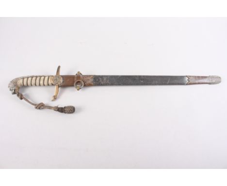 A midshipman's mid 19th century naval dirk and scabbard with sword knot, blade inscribed "Chief Captains Prize awarded to Mr 