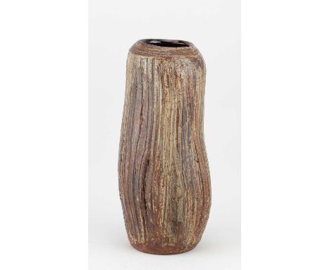 † JANET LEACH (1918-1997) for Leach Pottery; a tall fluted stoneware vase partially covered in ash glaze, impressed JL and po