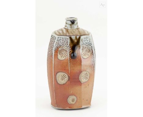 † PHIL ROGERS (1951-2020); a tall faceted salt glazed bottle with running green ash top and impressed shell decoration, impre