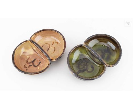 † SIDNEY TUSTIN (1914-2005) for Winchcombe Pottery; a pair of slipware double jam dishes, impressed ST and pottery marks, lon