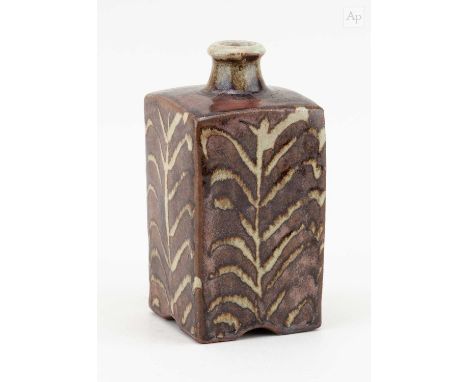 † PHIL ROGERS (1951-2020); a square stoneware bottle covered in tenmoku breaking to kaki glaze with wax resist decoration, im