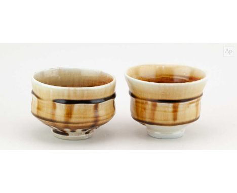 † PHIL ROGERS (1951-2020); a porcelain chawan washed with iron glaze, impressed PR mark, diameter 11.5cm, and a slightly smal