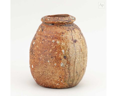 † CHUCK SCHWARTZ (1935-2019); a bulbous wood fired stoneware vessel partially covered in green ash glaze with feldspar inclus