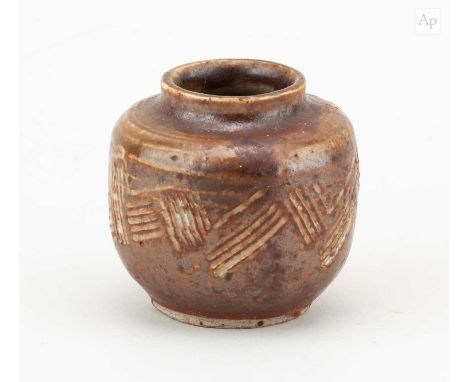 † WILLIAM STAITE MURRAY (1881-1962); a miniature stoneware jar covered in iron glaze with incised decoration, impressed M mar