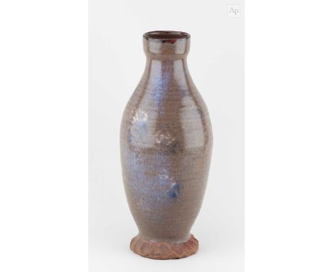 † WILLIAM STAITE MURRAY (1881-1962); a tall stoneware bottle with splayed base covered in green/grey glaze with pale yellow a