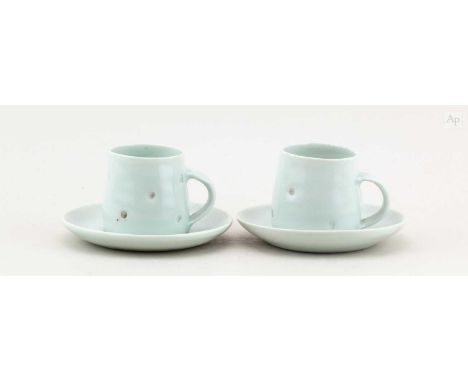 † EDMUND DE WAAL (born 1964); a pair of small porcelain cups and saucers covered in celadon glaze with impressed decoration p