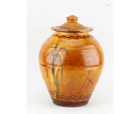 † CLIVE BOWEN (born 1943); a large slipware jar and cover with trailed decoration on honey ground, height 37.5cm.Condition Re