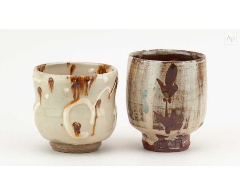 TAKESHI YASUDA (born 1943); a stoneware yunomi covered in nisai glaze with raised slip decoration, impressed mark, height 9cm