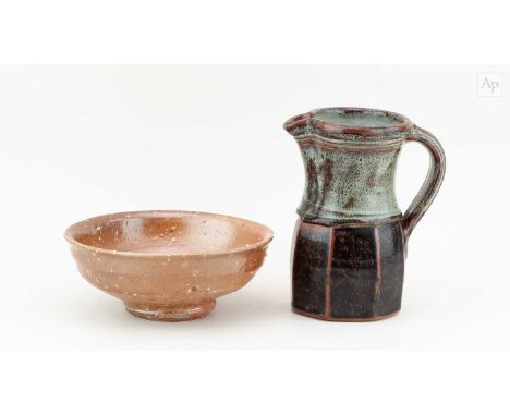† PHIL ROGERS (1951-2020); a partially faceted stoneware jug covered in tenmoku breaking to kaki and nuka glaze, impressed PR