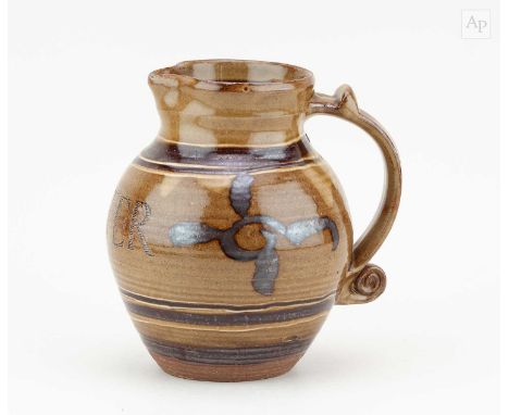 † SETH CARDEW (1934-2016) for Wenford Bridge Pottery; a stoneware jug covered in ochre glaze with iron decoration and incised