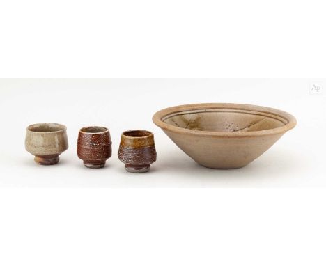 † PHIL ROGERS (1951-2020); a stoneware bowl partially covered in green ash glaze with incised and impressed decoration, impre