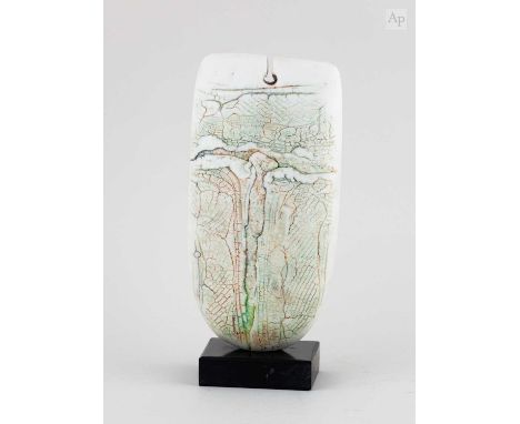 † PETER HAYES (born 1946); a raku bow with fractured white surface and keyhole mounted on a slate base, inscribed signature d