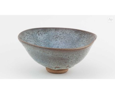 † WILLIAM STAITE MURRAY (1881-1962); a stoneware bowl covered in pitted blue/grey glaze, impressed M mark, diameter 18cm.Prov