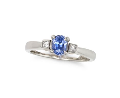 NO RESERVE - A SAPPHIRE AND DIAMOND THREE STONE RING in platinum, set with an oval cut sapphire between two princess cut diam