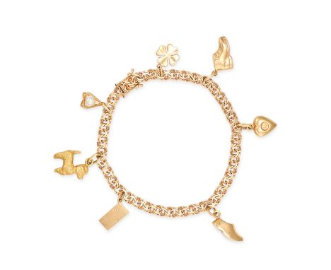 A GOLD CHARM BRACELET in 18ct yellow gold, the fancy link bracelet suspending several charms including a pearl, a poodle, a t