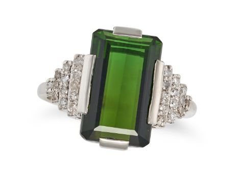 A GREEN TOURMALINE AND DIAMOND DRESS RING set with an octagonal step cut green tourmaline, the geometric shoulders set with r