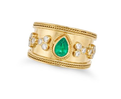 AN EMERALD AND DIAMOND RING in 18ct yellow gold, set with a pear cut emerald, accented by round brilliant cut diamonds,&nbsp;