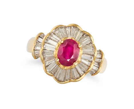 A RUBY AND DIAMOND CLUSTER RING in 18ct yellow gold, set with an oval cut ruby in a cluster of tapered baguette cut diamonds,