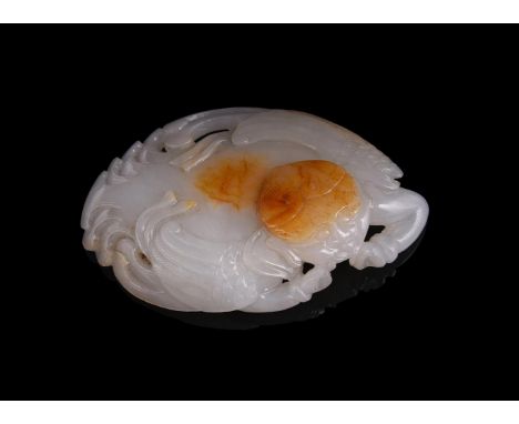 A Chinese white and russet jade plaque of winged mythical figure, 8.5cm long x 5.5cm wide白玉镂雕有翼神人牌Condition Report: jade with