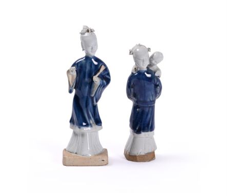 Two Chinese biscuit blue-glazed figures, Qing Dynasty, circa 1750, one depicting a lady and child and the other with a lady h