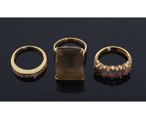 Three gold rings. diamond half eternity ring, channel set mounted in 9ct gold, Smoky quartz single stone dress ring 9ct gold 