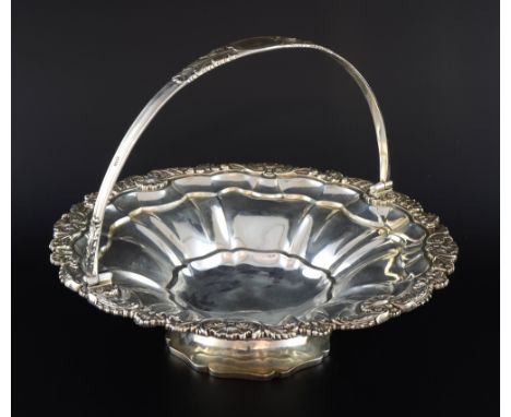 George IV silver swing-handled dish with shell and scroll rim on shaped foot, by Joseph Angell I, London, 1825, 38oz, 1181g,