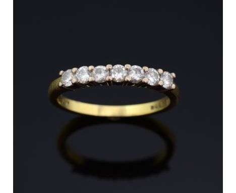 Diamond set half eternity ring set with seven diamonds of .07 carat. Total diamond weight 0.42cts  