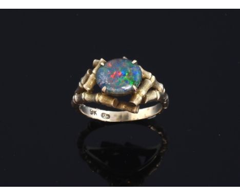  Gold ring mounted with opal doublet. 9ct yellow gold  