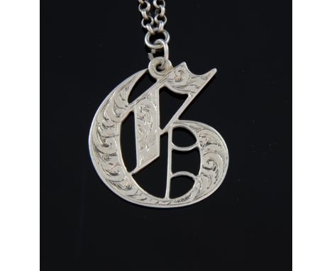 Victorian silver decanter label 'G' with bright cut decoration, by George Unite, Birmingham, 1868,