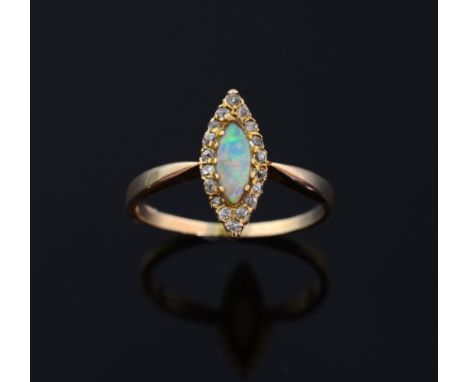 Edwardian opal and diamond marquise form ring. set in yellow gold, in shield form box 