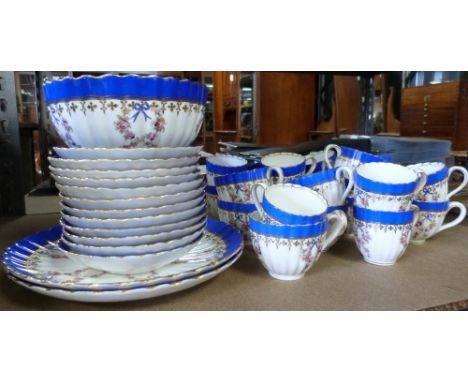 19th century Staffordshire part tea service with painted floral decoration and main blue and gilt band, comprising twelve cof