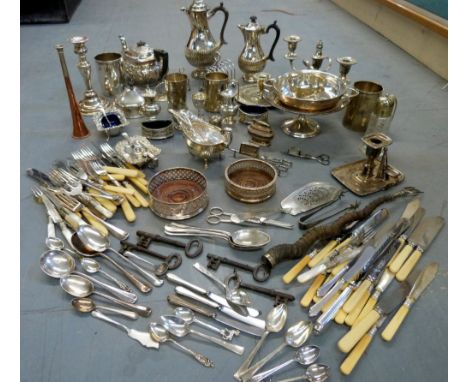 Large of selection of silver plated wares to include two hotwater jugs, three-light candelabra, tea pot, toast racks, toastin