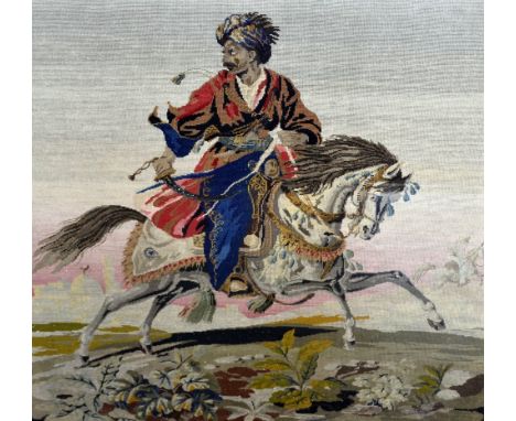 Large 19th century tapestry with bead work  Indian  gentleman  in a turban on horseback within architectural gold painted fra
