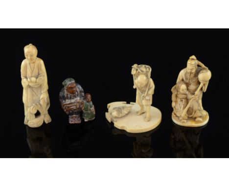 Painted wood Netsuke of an old lady with her shopping and three carved Ivory Okimono  one signed