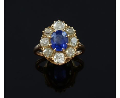 Edwardian sapphire and diamond cluster ring, oval cut sapphire to centre weighing approximately 2.15cts within a surround of 