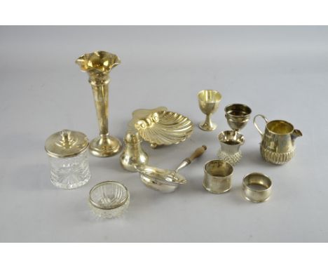 Victorian silver shell shaped dish on three ball feet, London, 1898, and other small silver items to include a trumpet vase, 