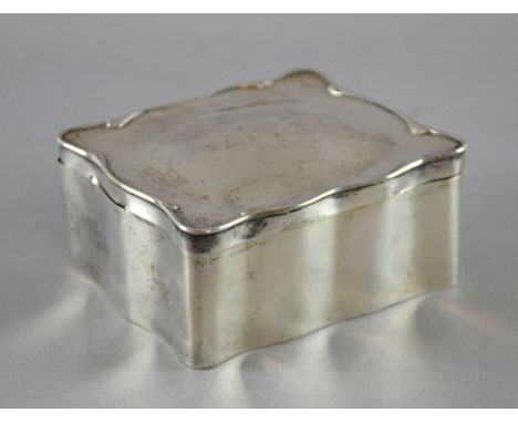 Silver trinket box of shaped rectangular form opening to reveal a velvet lined interior,  Birmingham 1893, 11 cm wide