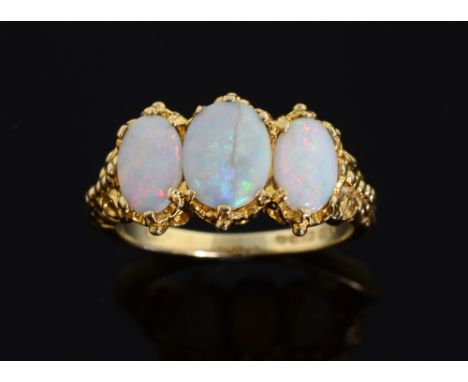 Opal set ring. three opals in 9ct gold mount