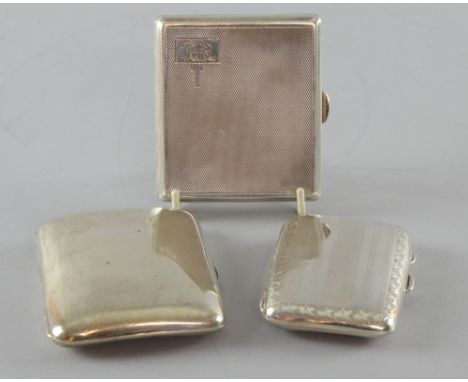 Three silver cigarette cases, one plain, one with engine turned decoration and the other with bright cut decoration, various 