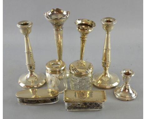 Pair of George V silver candlesticks by W I Broadway & Co., Birmingham, 1931, two trumpet vases, squat candlestick (all with 