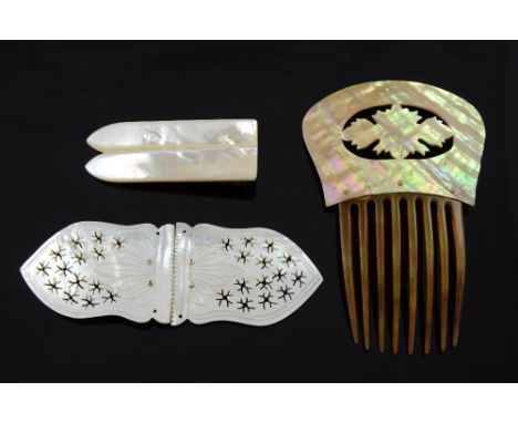 Mother of pearl Buckle with pierced decoration 13cm a hair comb and a hair clip PROVENANCE; A single owner collection of moth