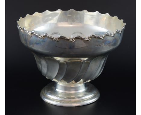 Edward VII silver punch bowl with half-gadrooned body and shaped rim on round foot, by Elkington & Co., Birmingham, 1907, 28o