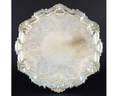 Edward VII silver salver with scroll and shell rim, engraved decoration on three scroll feet, by Hawksworth, Eyre & Co. Ltd.,